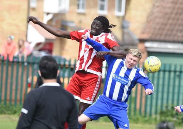 Ali Nyang (red) scored for Peterborough Sports Reserves against Thrapston.