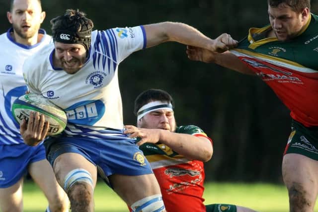 Sam Crooks grits his teeth for the Lions against Sandbach. Picture: Mick Sutterby