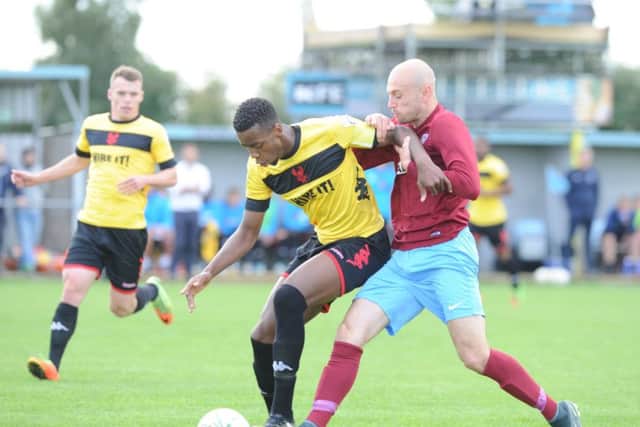 Dan Schiavi (right) scored a brilliant goal direct from a free kick for Deeping at Eynesbury.