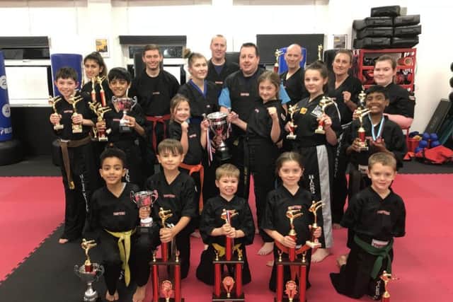The successful Hicks Karate School fighters were from t he left, back, Elise Ward, Aaron Dickerson, instructor Atlanta Hickman, David Cairns, chief instructor Andrew Hicks, David Prior, Sarah Ward, Chloe Prior, middle, Aaron Leonard, Shiv Panchal, Sophie Hicks, Lucy Hicks, Casey Stone, Raihan Ebrahim, front, Joell Celaire, Denas Jankauskas, Joshua Leonard, Sophie Doyle and Oliver Profitt.