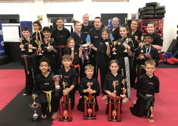 The successful Hicks Karate School fighters were from t he left, back, Elise Ward, Aaron Dickerson, instructor Atlanta Hickman, David Cairns, chief instructor Andrew Hicks, David Prior, Sarah Ward, Chloe Prior, middle, Aaron Leonard, Shiv Panchal, Sophie Hicks, Lucy Hicks, Casey Stone, Raihan Ebrahim, front, Joell Celaire, Denas Jankauskas, Joshua Leonard, Sophie Doyle and Oliver Profitt.