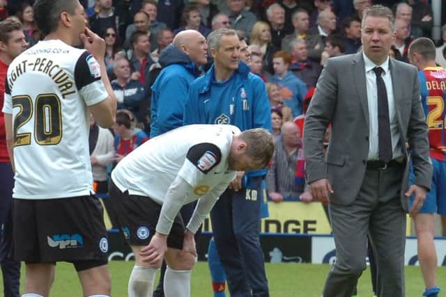 Grant McCann and Darren Ferguson (right) are hurting after a relegation-clinching defeat at Crystal Palace.
