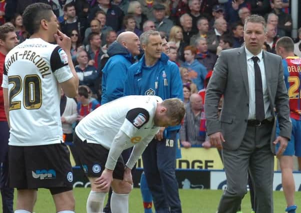 Grant McCann and Darren Ferguson (right) are hurting after a relegation-clinching defeat at Crystal Palace.