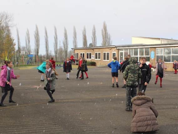 Children at John Clare Primary School in Helpston enjoyed chasing the snowflakes