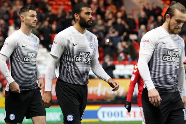 Posh defender Alex Penny (centre) walks out for his full Football League debut at Charlton. Photo: Joe Dent/theposh.com.