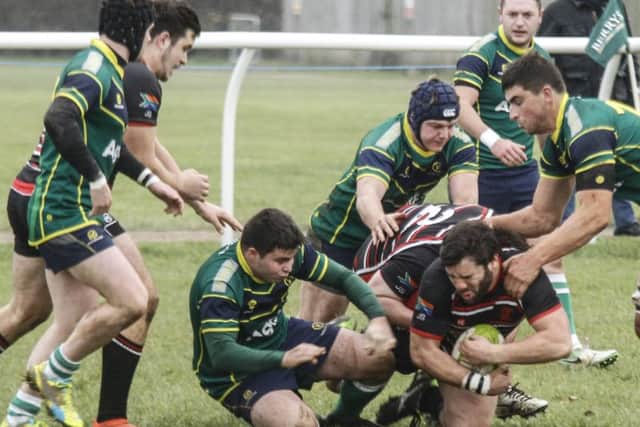 Oundle's Saad Sait battles for possession against Huntingdon. Picture: Mark Shore