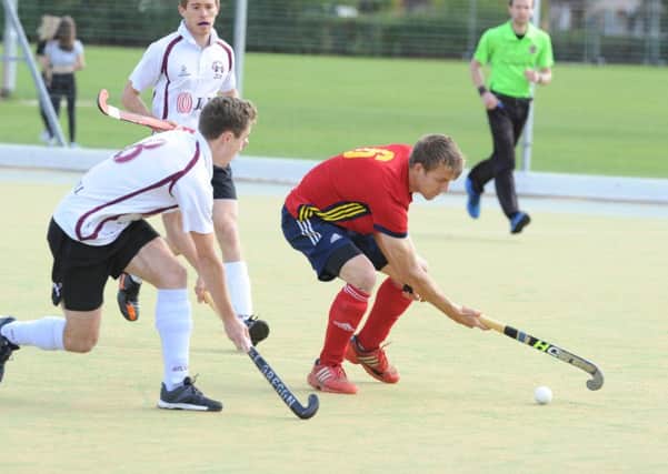 Ben Read (red) scored twice for City of Peterborough at Cambridge University.
