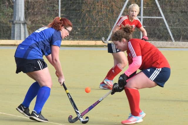 Action from City of Peterborough Ladies 4ths (red) against Woodhall Spa. Photo: David Lowndes.