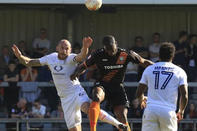 One Posh fan wants his club to sign John Akinde (centre) from Barnet.