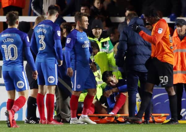 Posh centre back Ryan Tafazolli is about to be stretchered off in the game against Southend.  Photo: Joe Dent/theposh.com.