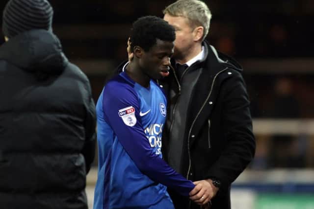 Leo Da Silva Lopes is consoled by manager Grant McCann after limping off with a hamstring injury. Photo: Joe Dent/theposh.com.