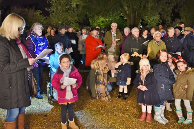 Lights of Love service 2016 at Sue Ryder Thorpe Hall .Visitors singing carols EMN-161112-194242009