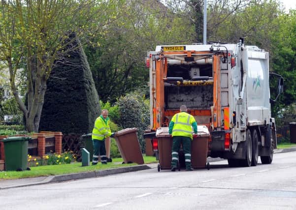 Brown bins being collected in Werrington, Peterborough  EMN-140904-085451001