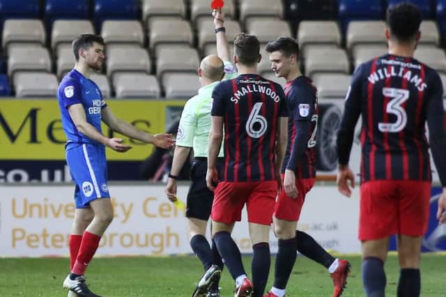 Jack Baldwin of Peterborough United is shown a red card by the match referee - Mandatory by-line: Joe Dent/JMP - 09/12/2017 - FOOTBALL - ABAX Stadium - Peterborough, England - Peterborough United v Blackburn Rovers - Sky Bet League One