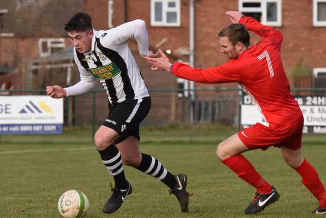 Warren McSkelly (stripes) in action for Peterborough Northern Star against Kirby Muxloe. Picture: Chantelle McDonald