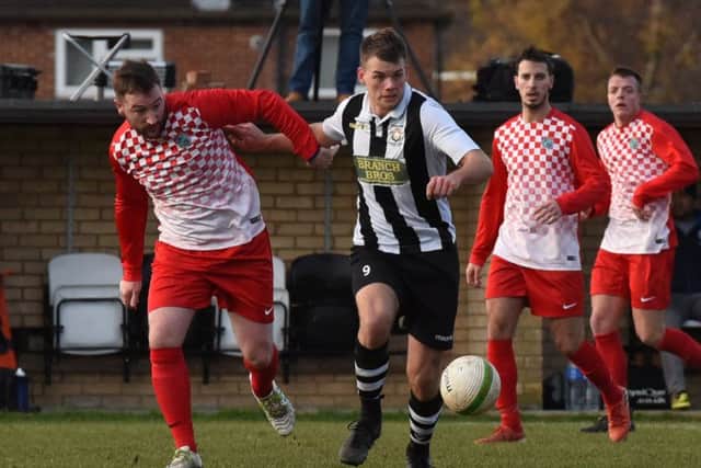 James Hill-Seekings (stripes) in action for Peterborough Northern Star against Kirby Muxloe. Picture: Chantelle McDonald