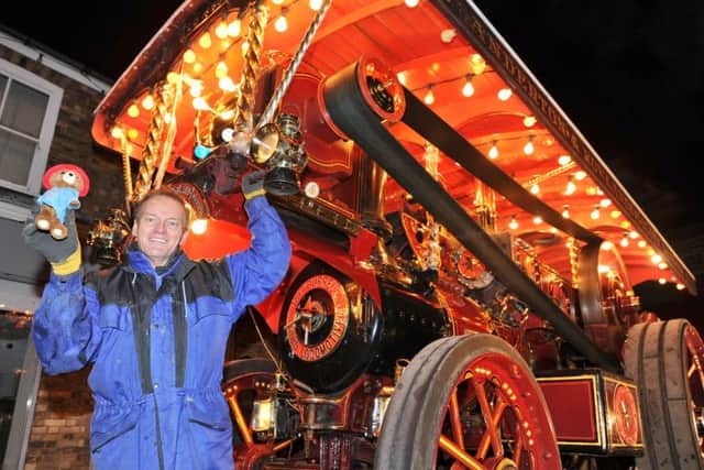 The annual Whittlesey Extravaganza on the Market Place. Chris Barber with the 1921 Burrell road locomotive engine EMN-170812-192734009