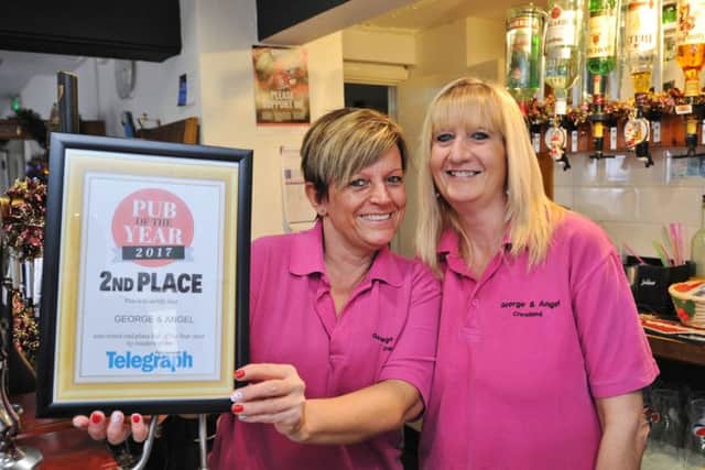 Peterborough Telegraph Pub of the Year awards runners-up Kim Fradley and Claire Shaw, joint licencees of the George and Angel at Crowland EMN-171112-152320009