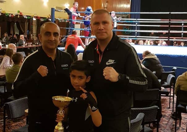 Aamir Shirazi with dad Akif and coch Chris Baker.