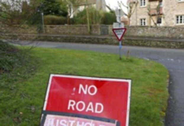 A Gloucestershire pothole vigilante got creative and made fake road signs to shame their local council into sorting crumbling road surfaces. Their escapades included changing a No Road Markings warning to read No Road, Just Holes and she even went as far as having a sign made saying CAUTION THIRD WORLD ROADS AHEAD after nearly ten villagers experienced car damage due to potholes in the area. (Photo credit Wilts Glos Standard)