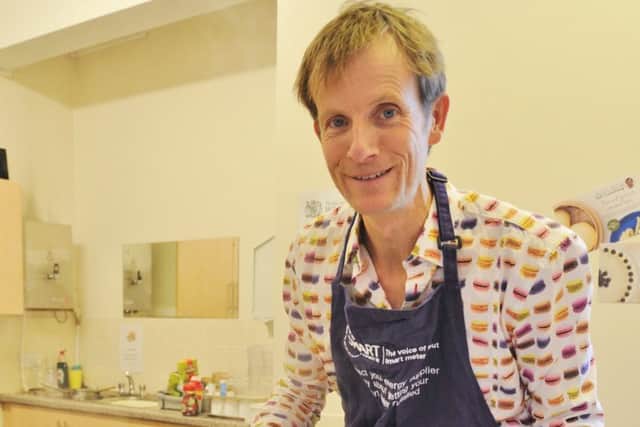 Bake Off finalist Ian Cumming talking to guests at Age UK, Lincoln Road about cooking and smart meters EMN-170812-192420009