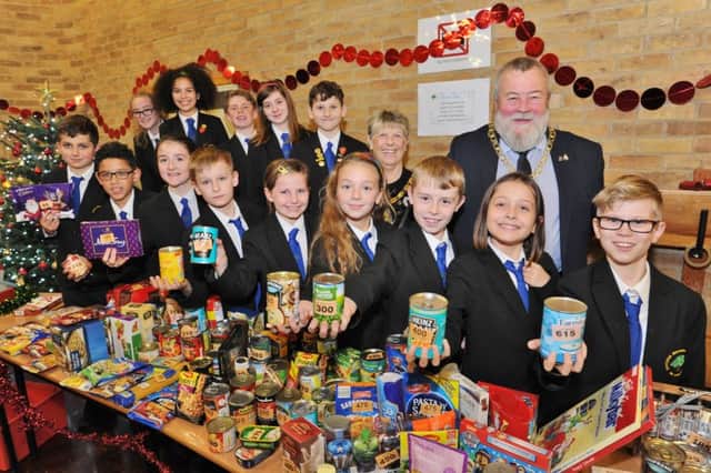 Mayor of Peterborough Coun. John Fox and Mayoress Judy Fox with pupils at the Omiston Meadows primary academy frost fair EMN-170312-094312009