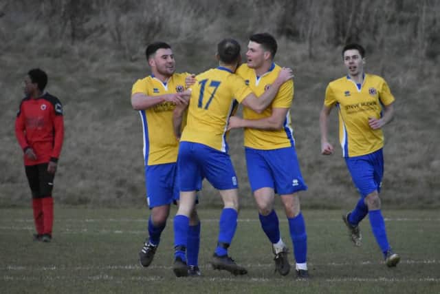Stamford Lions celebrate their late equaliser against Netherton last weekend. Photo: James Richardson.