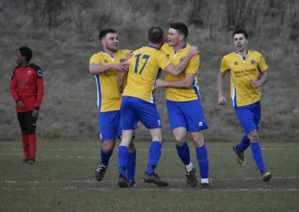 Stamford Lions celebrate their late equaliser against Netherton last weekend. Photo: James Richardson.