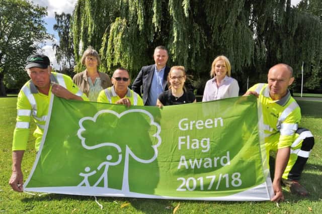 Green Flag presentation at Central Park. Coun. Gavin  Elsey is pictured with  Arthur Fisher, Mark Graham and Ian Lilley  and Shelly Cash (second right)  from Amey with Judy Jones from Friends of Central Park (second left) and  Filomena Terranova from the Buttercross Tearooms(third right) EMN-170408-163417009