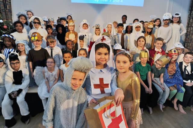 Year 3 and 4 pupils from Heritage Park primary school Christmas Nativity "A Midwife Crisis" including (front) b Joshua Harrold, Jessica Sayer and Layla Khodri EMN-170812-192322009