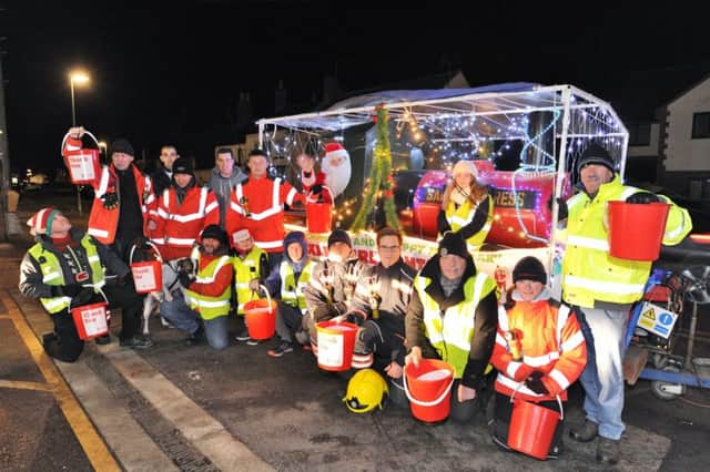 Yaxley firefighters with their annual Christmas float raising money for local charities and the firefighters  charity from collections in the Yaxley area EMN-171215-093500009
