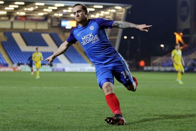 Posh striker Jack Marriott celebrates his 17th goal of the season against Woking on Tuesday. Photo: Joe Dent/theposh.com.