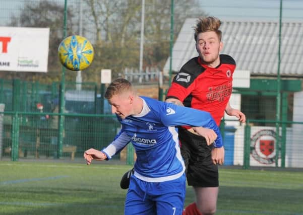 Action from Netherton's 6-0 win over Warboys (blue). Photo: David Lowndes.