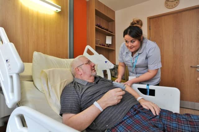 Staff working over Christmas at Sue Ryder, Thorpe Hall.  Patient Robert Unwin with nursing assistant Katie Harper EMN-171218-230558009