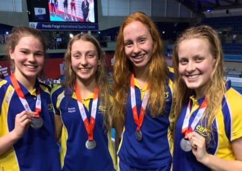 The COPS 4x200m freestyle relay team with their silver medals. From the left are  Mia Leech, Kenzie Whyatt, Poppy Richardson and Chloe Hannam.