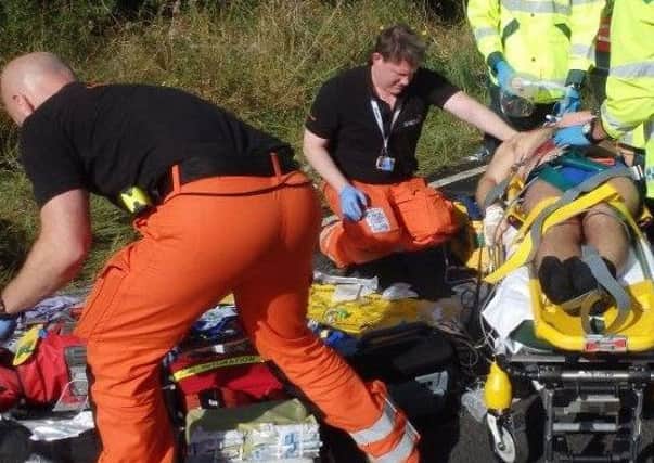 Medics work to save Adam's life