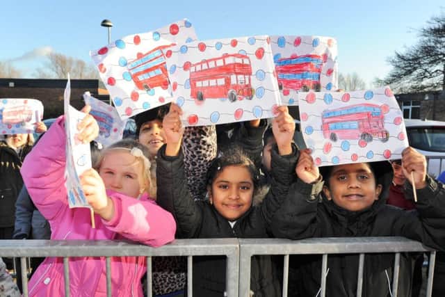 Pupils from St Thomas More RC primary school out to welcome the arrival of their double decker bus which is to be converted into a library. EMN-170812-192626009