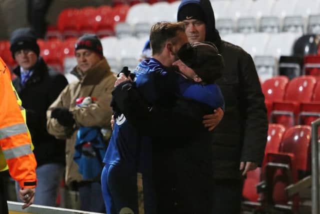 Danny Lloyd celebrates his Posh matchwinner at Fleetwood with his grandad, George. Photo: Joe Dent/theposh.com.