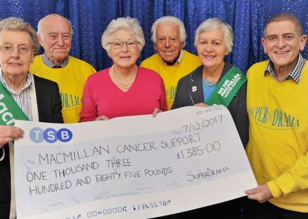 Judy Scotney, Ann Horrell and Abbey Knott from Macmillan cancer charity receive a cheque from John Moxon, Bill Marriott and Andy Sanders from Super-Drama following their first production EMN-170812-192334009