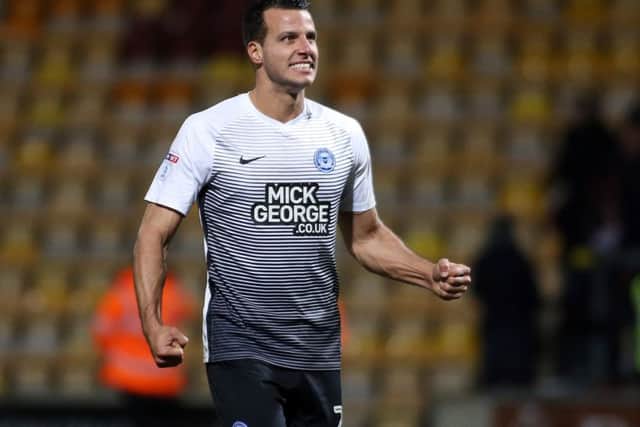 Steven Taylor celebrates the Posh win at Bradford City. Photo: Joe Dent/theposh.com.