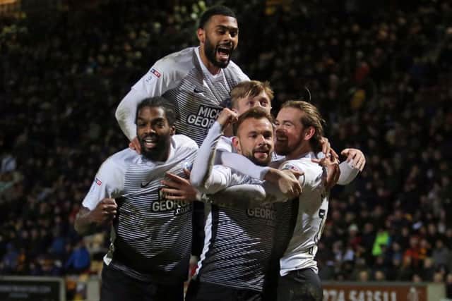 Posh players celebrate Jack Marriott's (right) second goal of the game against Bradford City. Photo: Joe Dent/theposh.com.
