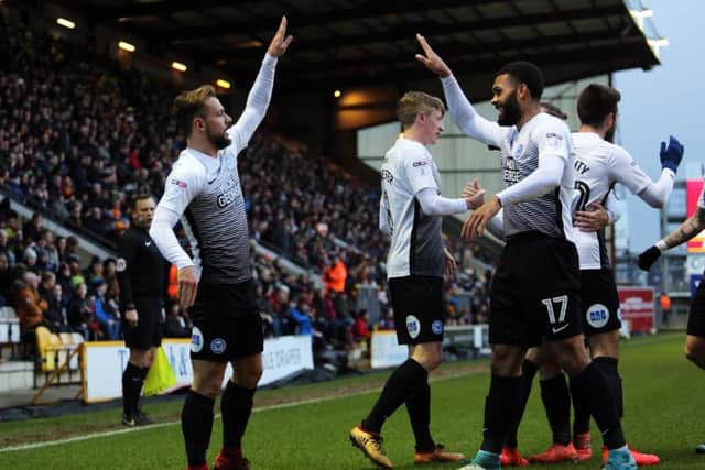Danny Lloyd (left) celebrates his goal for Posh at Bradford in unusual style with Alex Penny. Photo: Joe Dent/theposh.com.