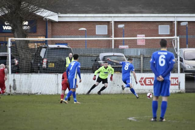 Lee Beeson scores from the penalty spot for Spalding against Peterborough Sports. Photo: James Richardson.
