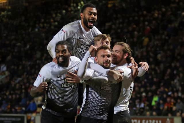 Alex Penny (top of the pile) has been compared to Mark Little by the Posh chairman.