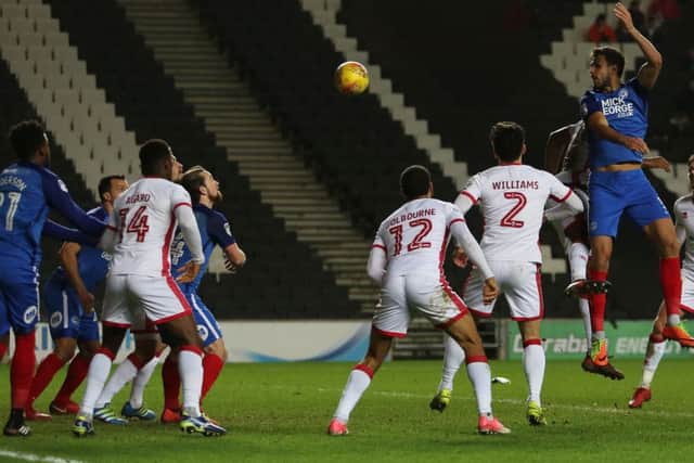 Posh centre-back Ryan Tafazolli heads at the MK Dons goal. Photo: Joe Dent/theposh.com.