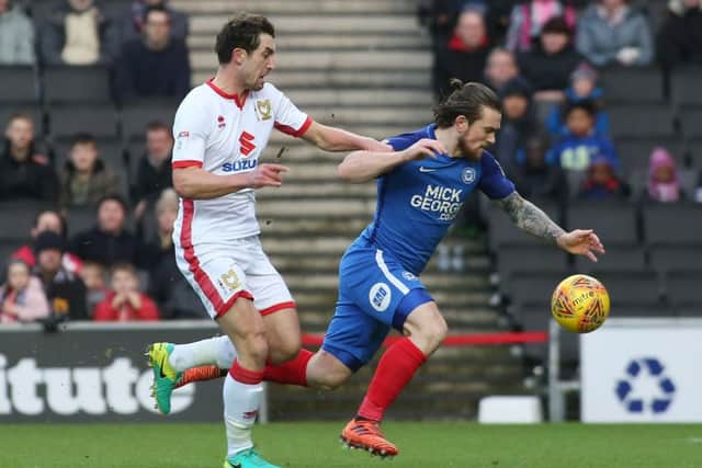 Posh striker Jack Marriott is brought down by Joe Walsh of MK Dons leading to an early red card. Photo: Joe Dent/theposh.com.