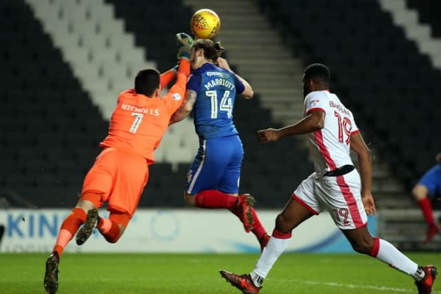 Posh striker Jack Marriott beats MK Dons 'keeper Lee Nicholls to this cross. Photo: Joe Dent/theposh.com.