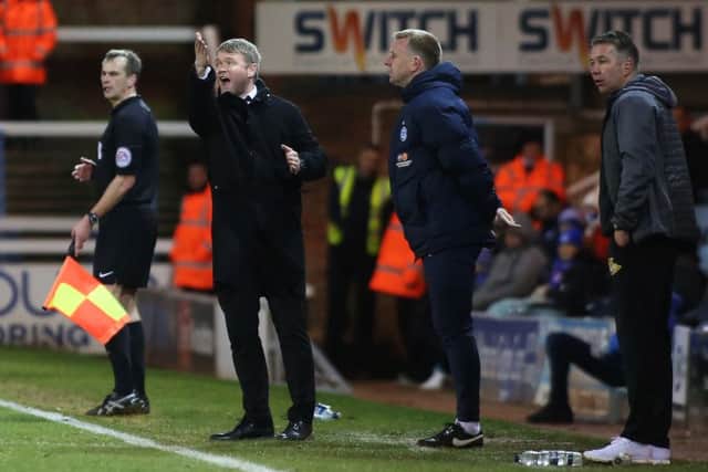 Posh manager Grant McCann issues instructions during the Doncaster game. Rovers boss Darren Ferguson is on the right. Photo: Joe Dent/theposh.com.