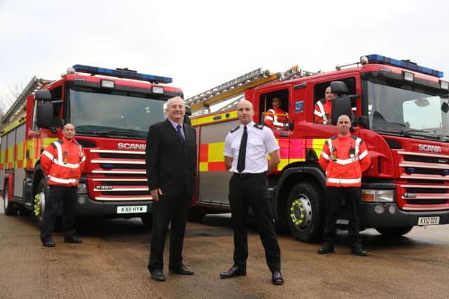 Assistant Chief Fire Officer Rick Hylton and Chairman of the Fire Authority Kevin Reynolds with the two additional fire engines.