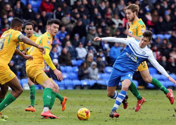 Kieffer Moore (second left, yellow) in action against Posh.